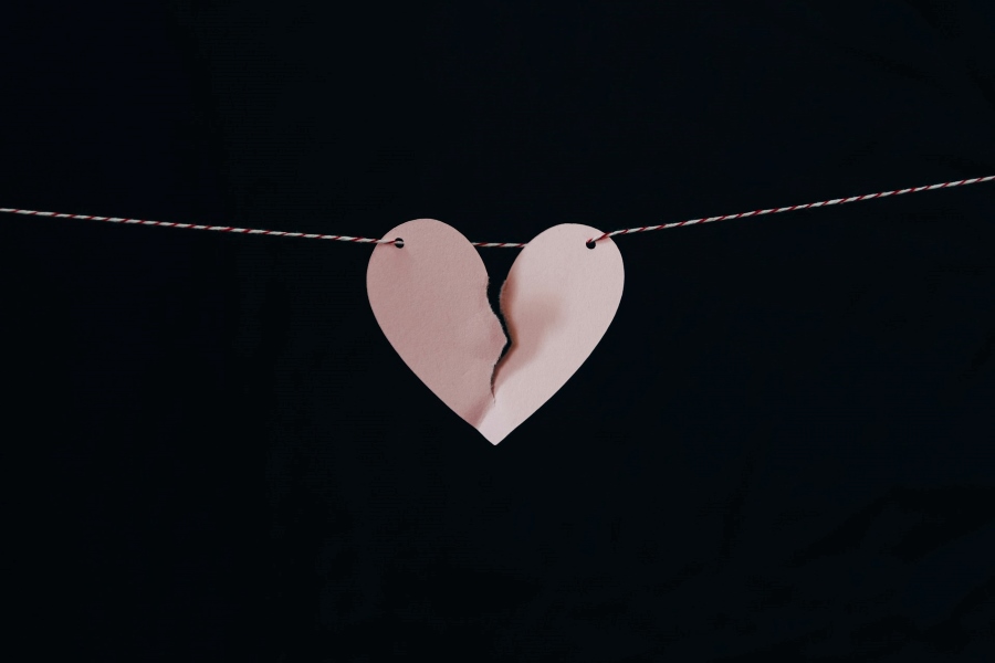 Broken paper heart on a string