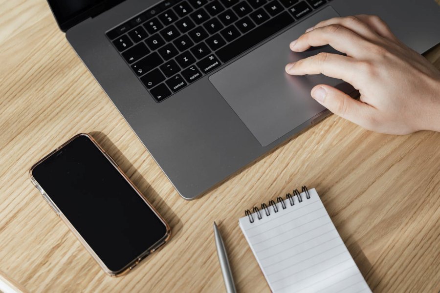 Person using an Apple laptop