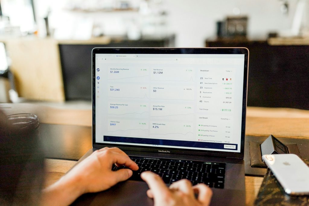 person using laptop on desk